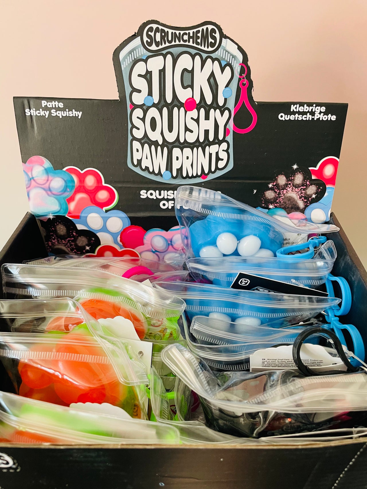 Black Scrunchems Sticky Squishy Paw Print in reusable PVC pouch