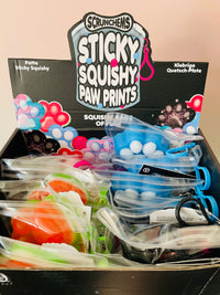Black Scrunchems Sticky Squishy Paw Print in reusable PVC pouch