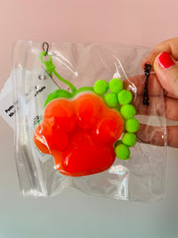 Green and Orange Scrunchems Sticky Squishy Paw Print sensory fidget toy