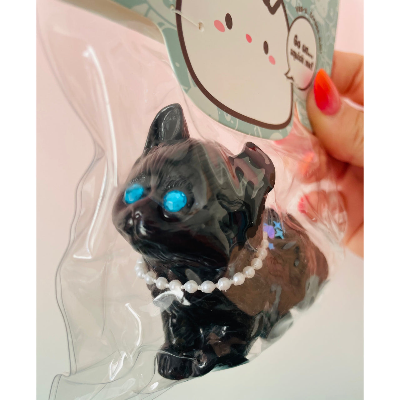 Jelli Squishy Pets Taba Black Cat Squishy Toy by Keycraft UK close up showing the cat's blue eyes
