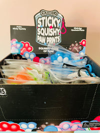 Black Scrunchems Sticky Squishy Paw Print in reusable PVC pouch