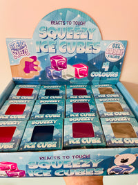 A retail display box of Squeezy Ice Cubes gel super filling ice cubes. The blue cardboard display box contains multiple small blue boxes of the ice cubes, each with a window showing the color of the gel inside.