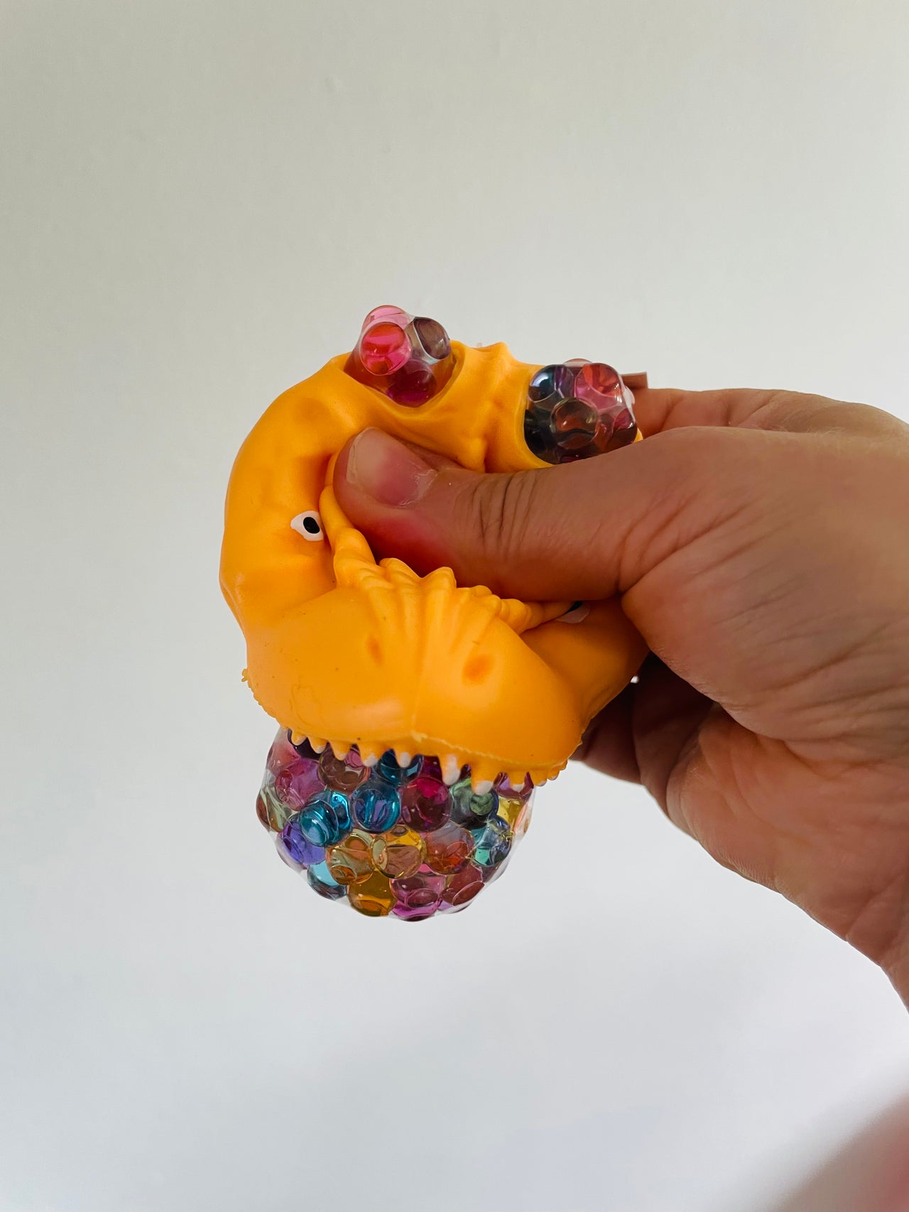 🦖🧡 Orange Dinosaur Head Bead Squeeze Toy